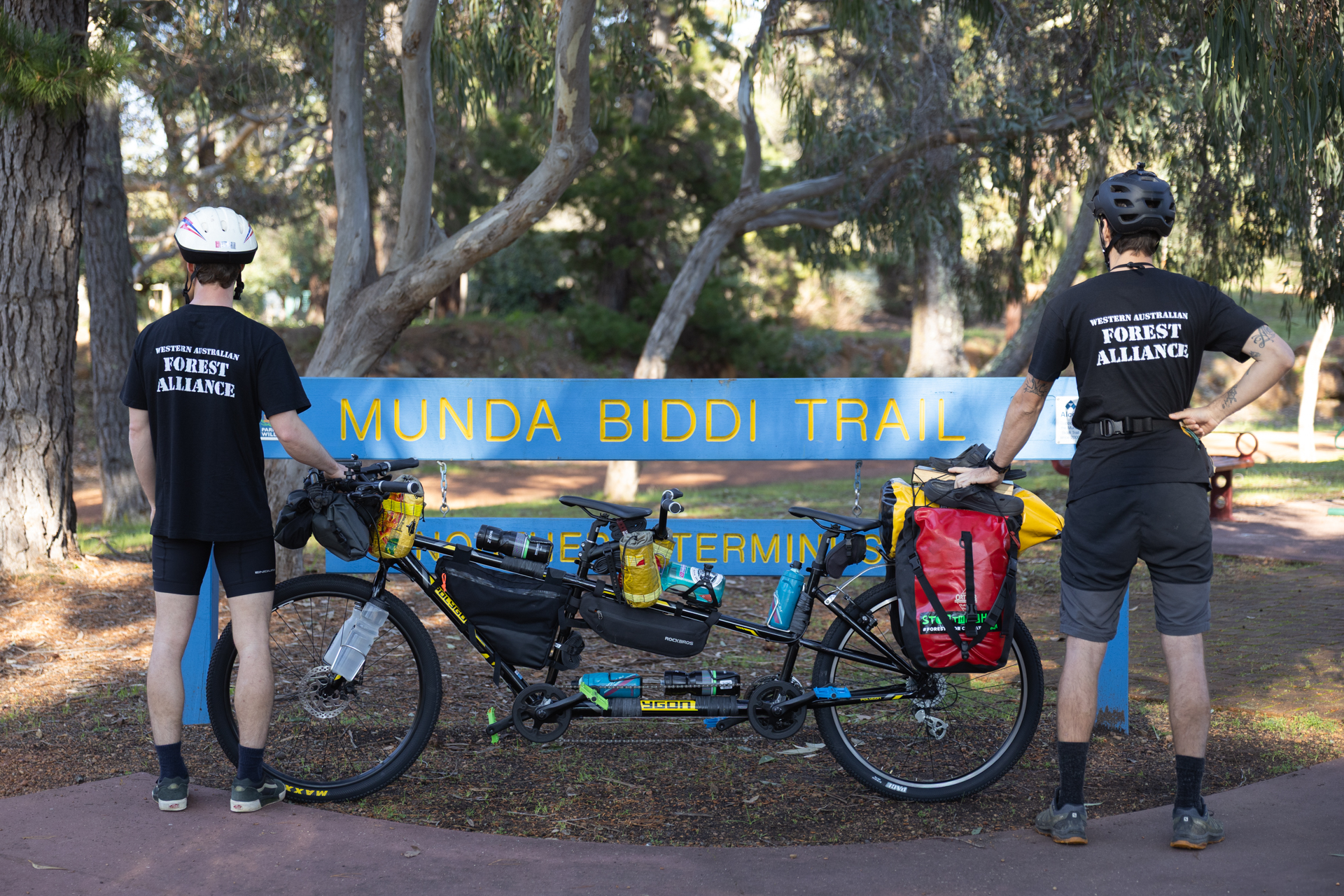 Kenny and Johno with their tandem bike at the Northern Terminus of the Munda Biddi trail in Mundaring